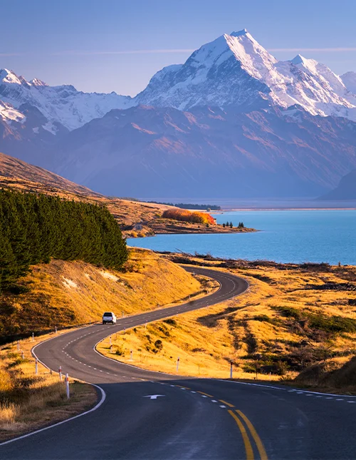 Mount Cook towers above the blue waters of Lake Pukaki on New Zealand's South Island.