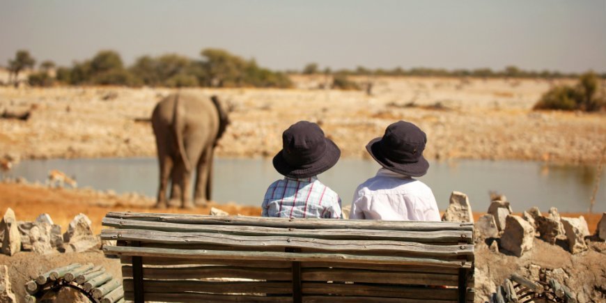 Boys by waterhole in Namibia