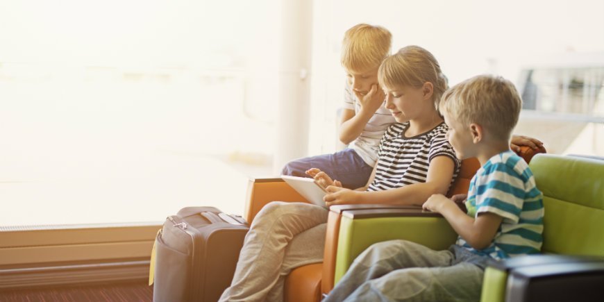 children waiting in airport