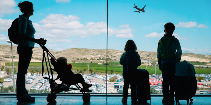 Mum waiting with children at the airport