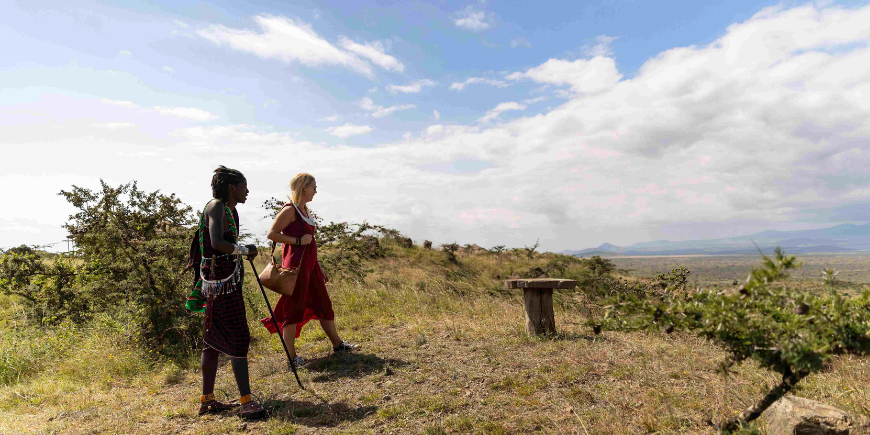 Travel specialist with Masai in Osiligilai camp in Tanzania