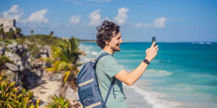 Man taking a photo of the surroundings in Tulum Mexico