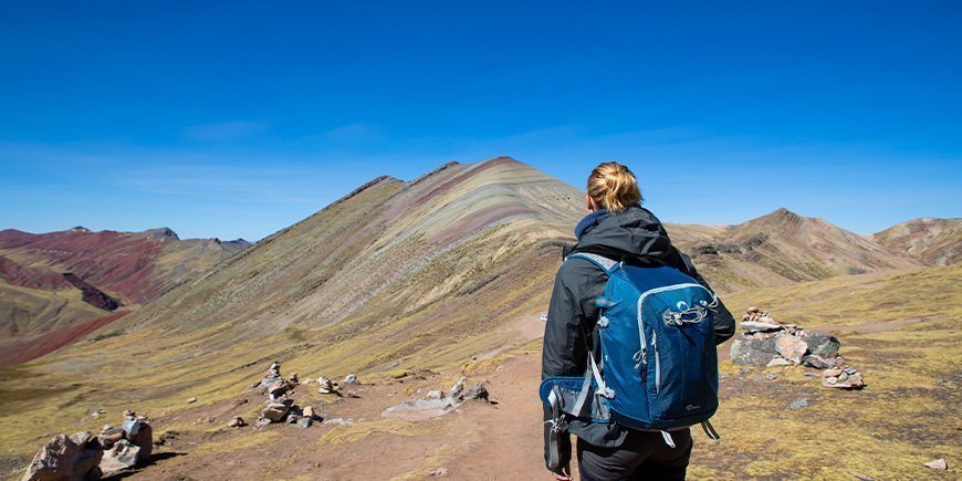 Woman walking in the Rainbow Mountains, Peru 