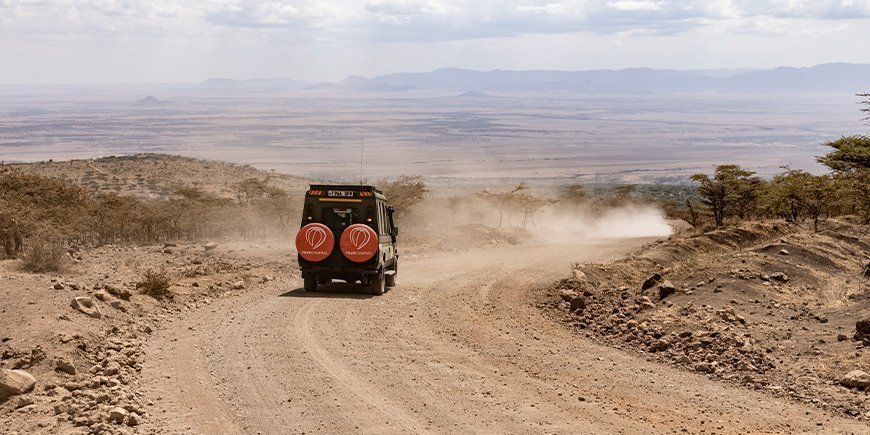 TourCompass car on a dirt road in Tanzania