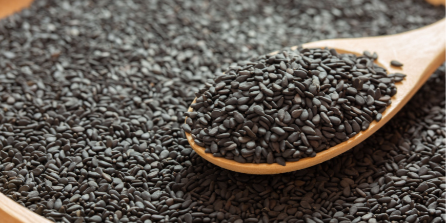 Black sesame on a wooden spoon 