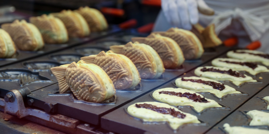 Person preparing taiyaki 