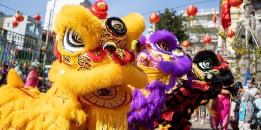 Parade with oversize costumes for the Vietnamese New Year celebration