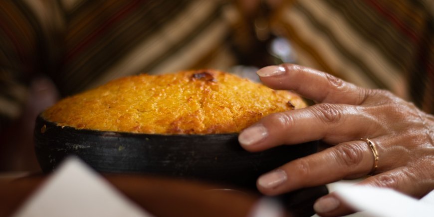 Person holding the pastel de choclo corn pie