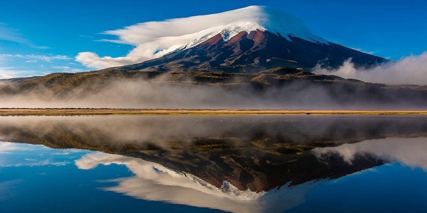 Cotopaxi volcano in Ecuador reflected in the water