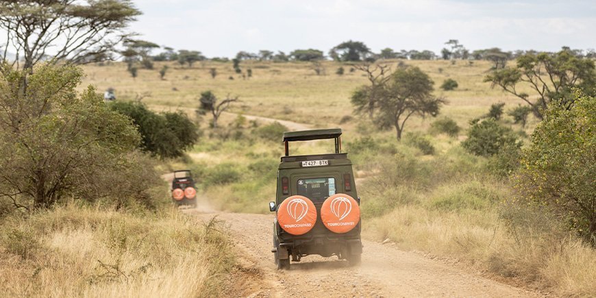 TourCompass safari jeep drives on the gravel in Tanzania