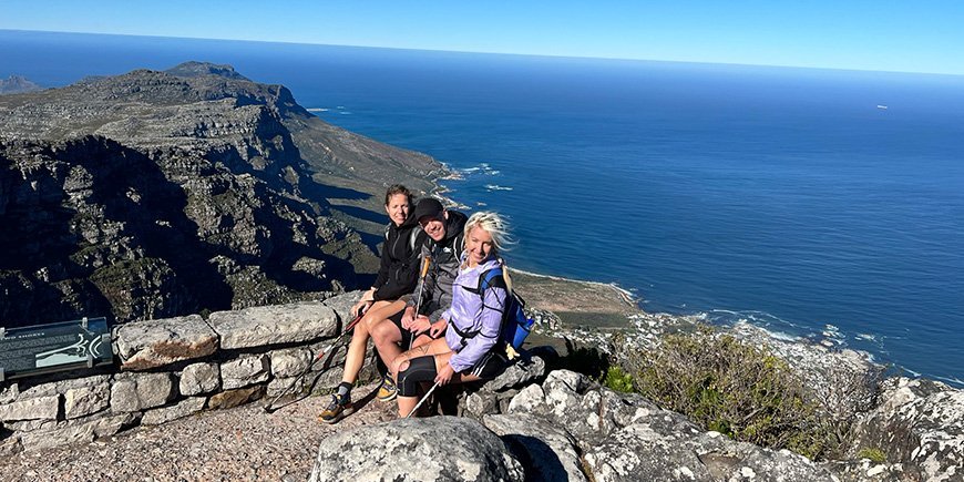 TourCompass team standing on top of Table Mountain in Cape Town.