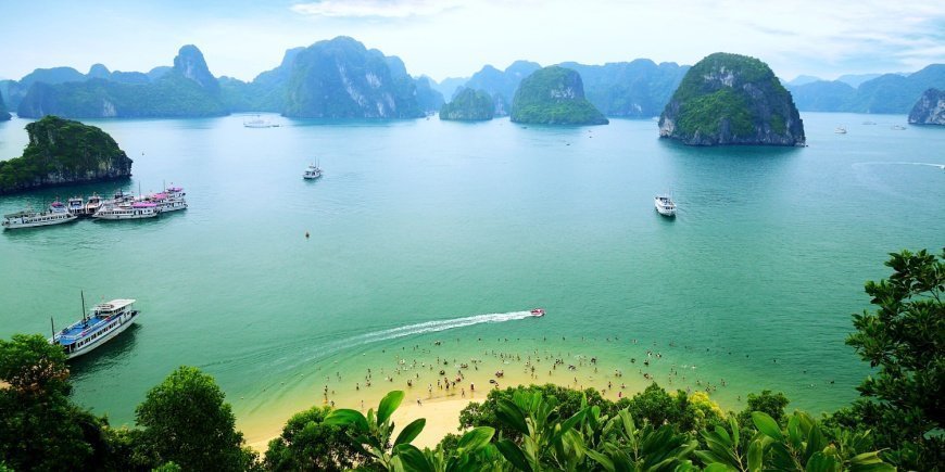 People bathing from the beach in Ha Long Bay