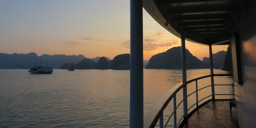 Sunset over Ha Long Bay seen from a boat