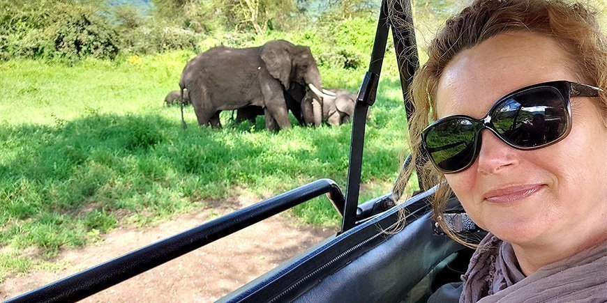 Women on safari looking at elephants in Tanzania