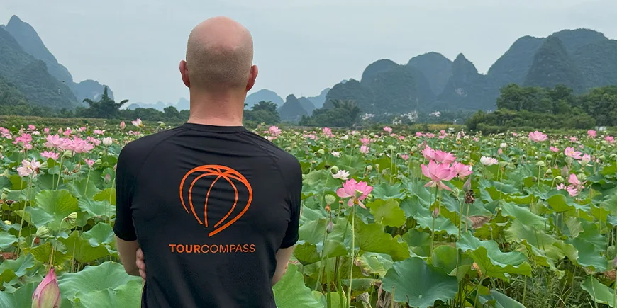 Claus looks out over the fields in Yangshuo, China