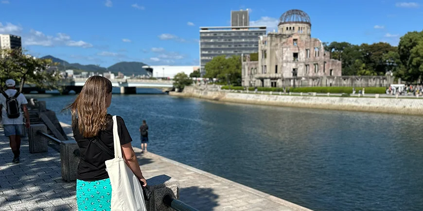 Woman looking at the Atomic Bomb Dome in Hiroshima, Japan