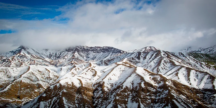 Snow-capped mountain peaks at the top of the Atlas Mountains