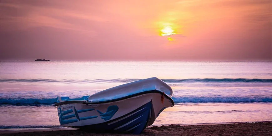 Boat at sunset off Nilaveli Beach