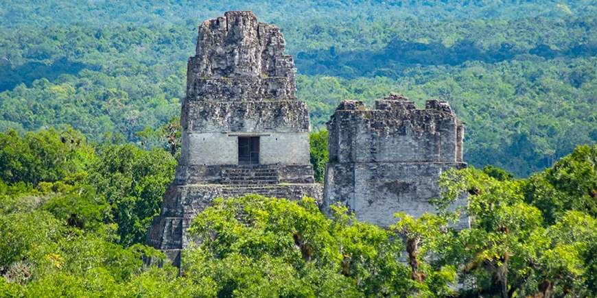 Ruins tower above the rainforest in Tikal National Park in Guatemala