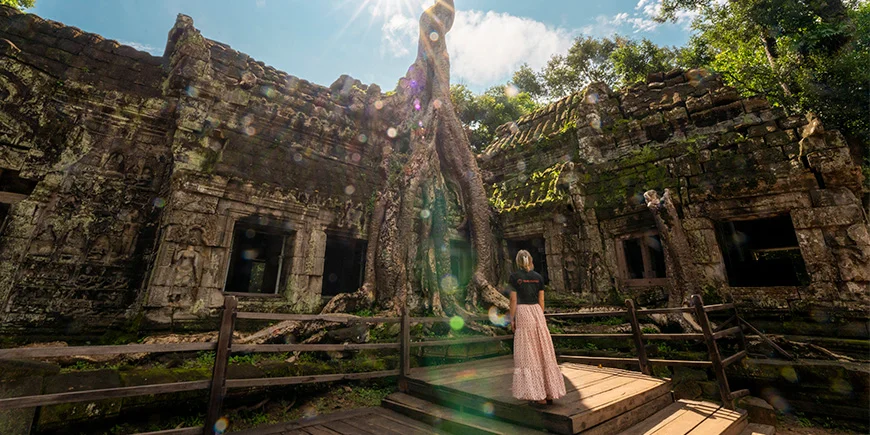A woman explores Angkor Wat in Cambodia