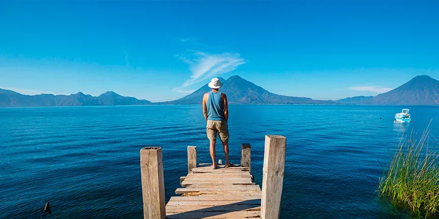 Man looking out over Lake Atitlán in Guatemala