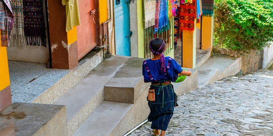 Maya woman walking down a street in Panajachel, Guatemala