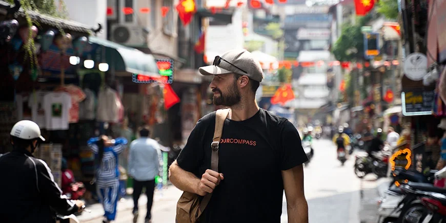 Man walking down a street in Hanoi, Vietnam