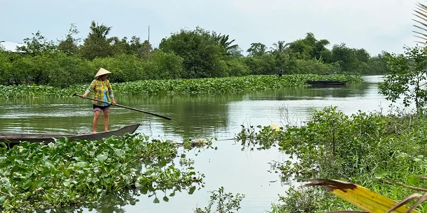Woman sailing on the Mekong Delta
