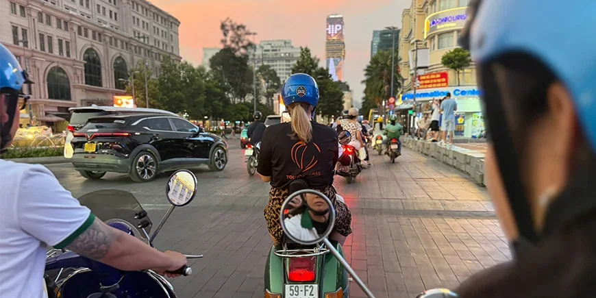 Michelle from TourCompass on a Vespa in Ho Chi Minh City