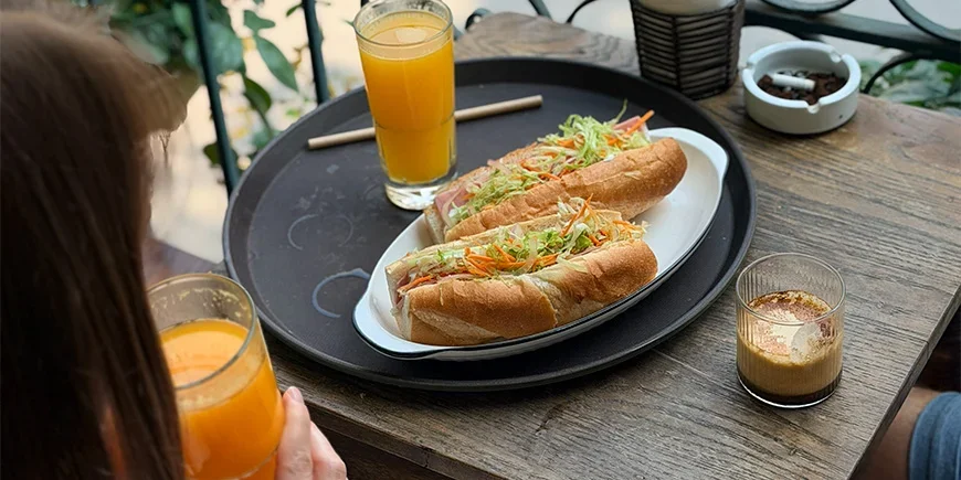 Banh Mi sandwich and coffee at a café in Hanoi