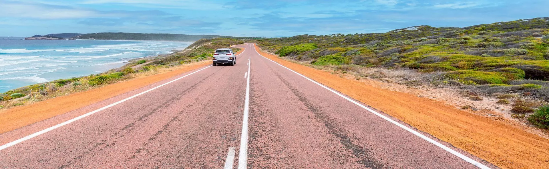Car travelling on the Great Ocean Road in Western Australia