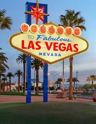 Iconic Las Vegas sign with palm trees in the background