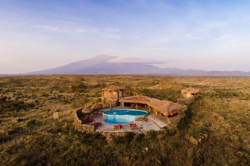 Osiligilai Maasai Lodge with Mount Kilimanjaro in the background