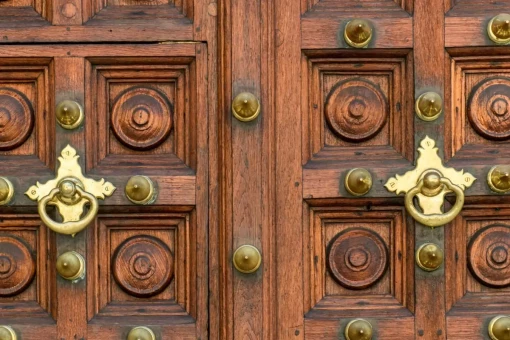 Three doors in Stone Town with Indian-style brass details