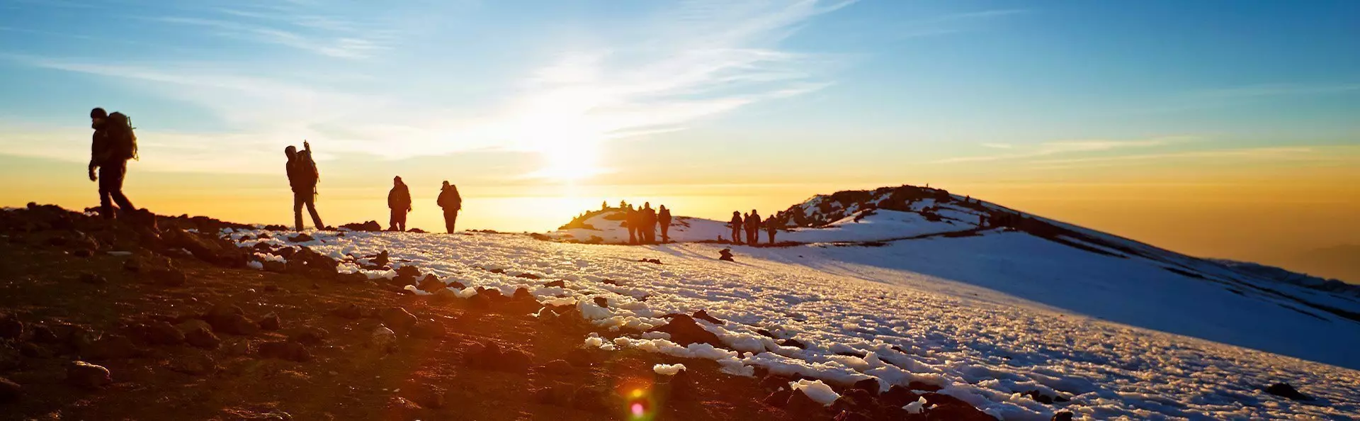 trekkers on Kilimanjaro at sunrise